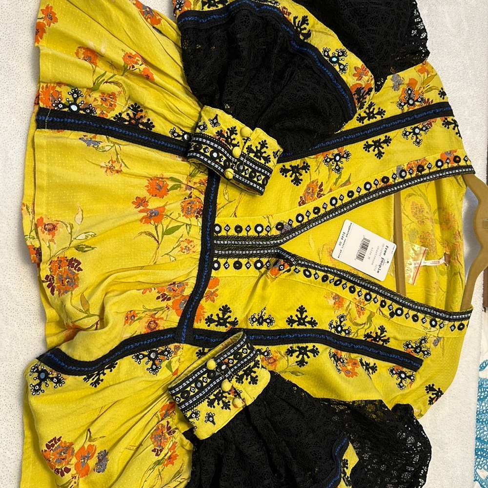 Free People blouse.  NWT - black lace sleeves and embellishment.
